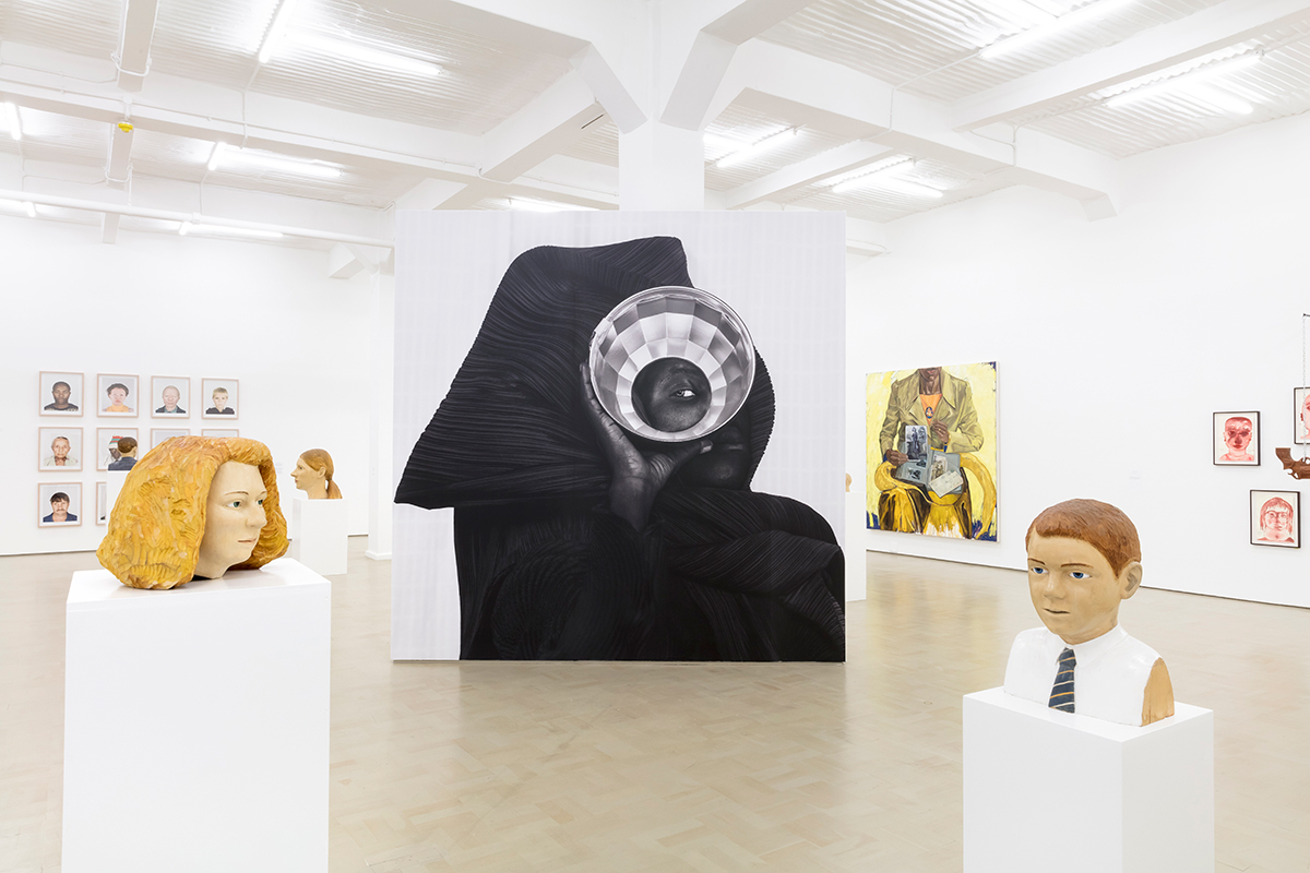 Installation view with works by Claudette Schreuders in foreground and Zanele Muholi in centre