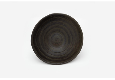 Dark bowl with circular lines