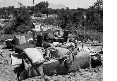 Mother and child in their home after the destruction of its shelter by officials of the Western Cape Development Board Crossroads, Cape Town, 11 October 1984