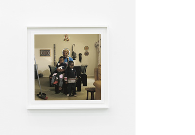 Victoria Cobokana, housekeeper, in her employer’s dining room with her son Sifiso and daughter Onica, Johannesburg, June 1999. Victoria died of AIDS on 13 December 1999, Sifiso died of AIDS on 12 January 2000, Onica died of AIDS in May 2000